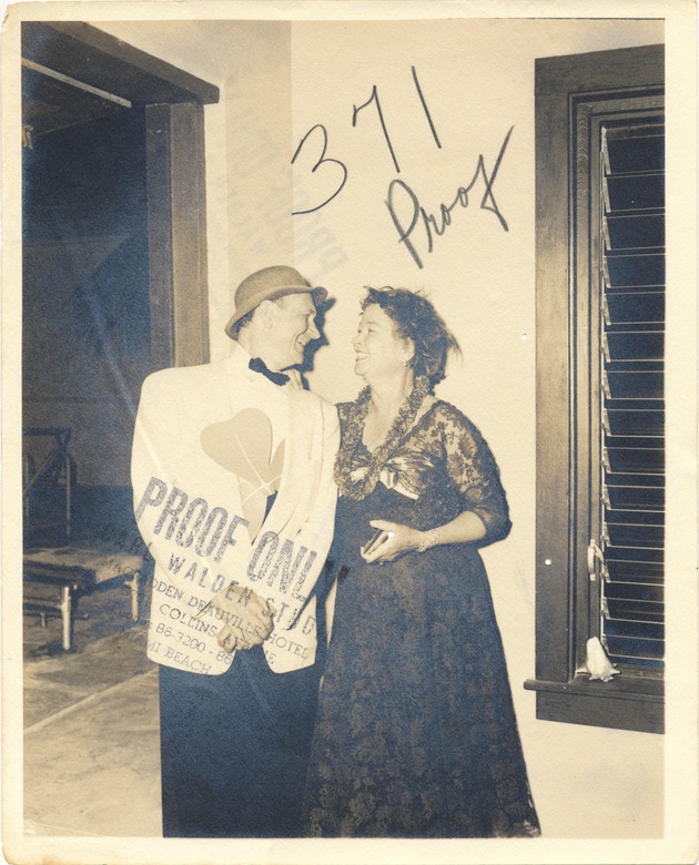 Photo proof of a couple, man holding a large shamrock - Recto Photograph